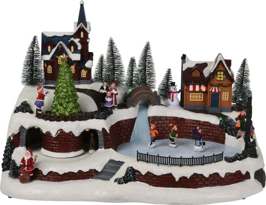 Maison de scène de village de Noël avec patineurs